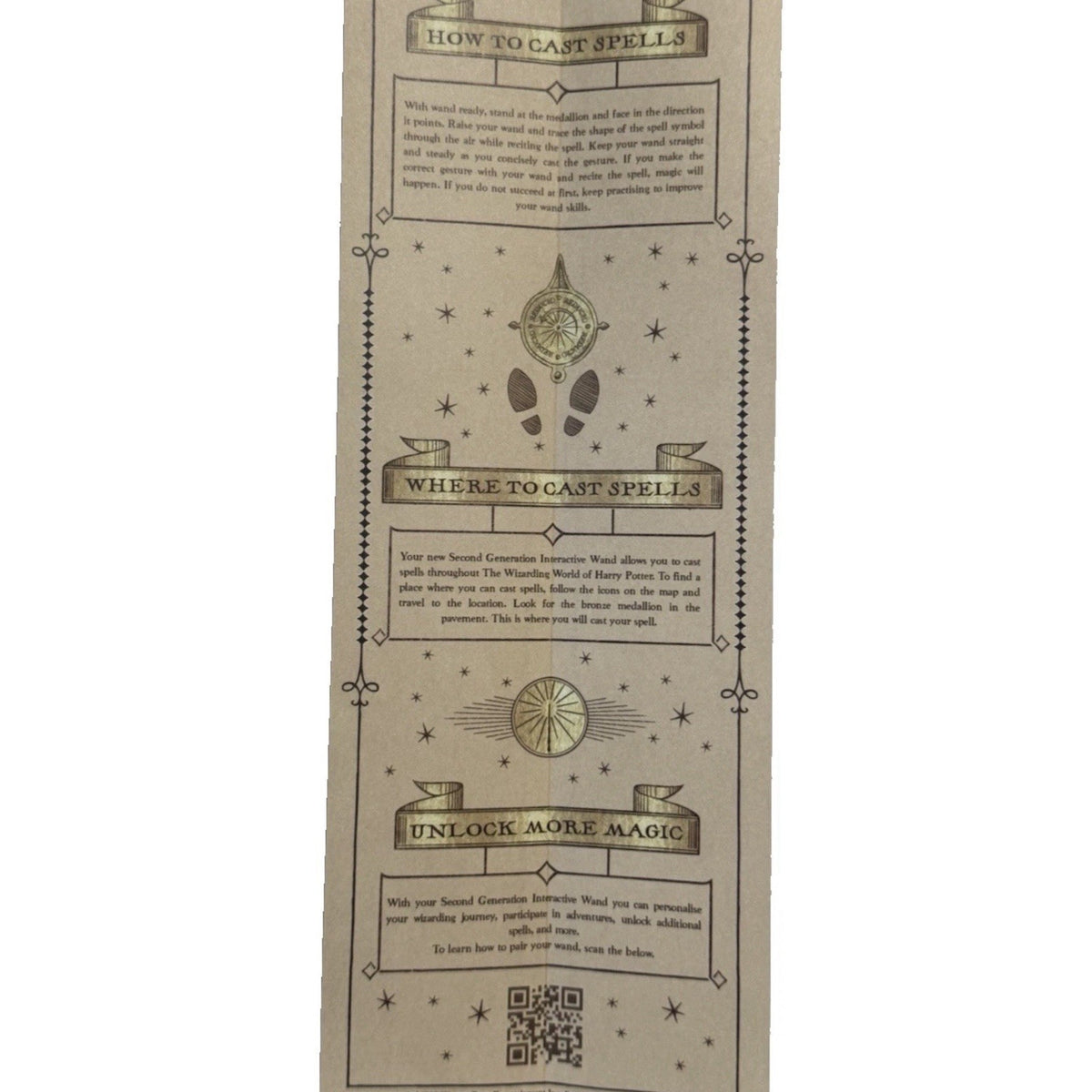 Unfolded wand instruction panel with spell-casting headings, decorative symbols and a QR code.